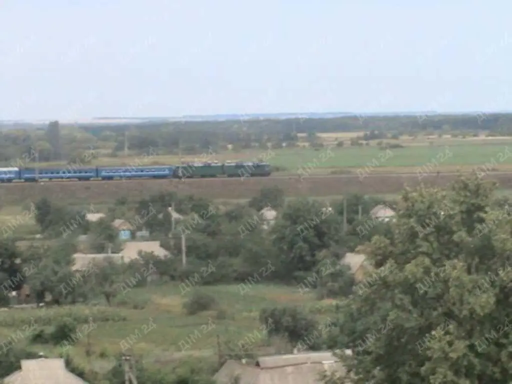 Ділянка з будинком в с.Коломак за Абазівкою.