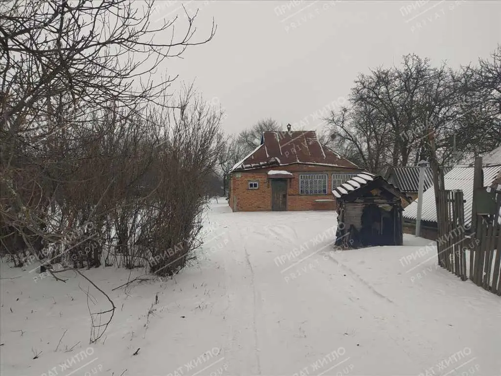 Ділянка з будинком під знос