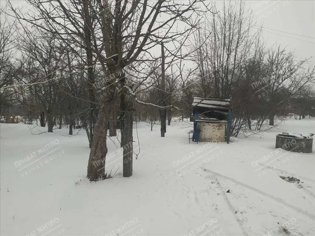 Ділянка з будинком під знос