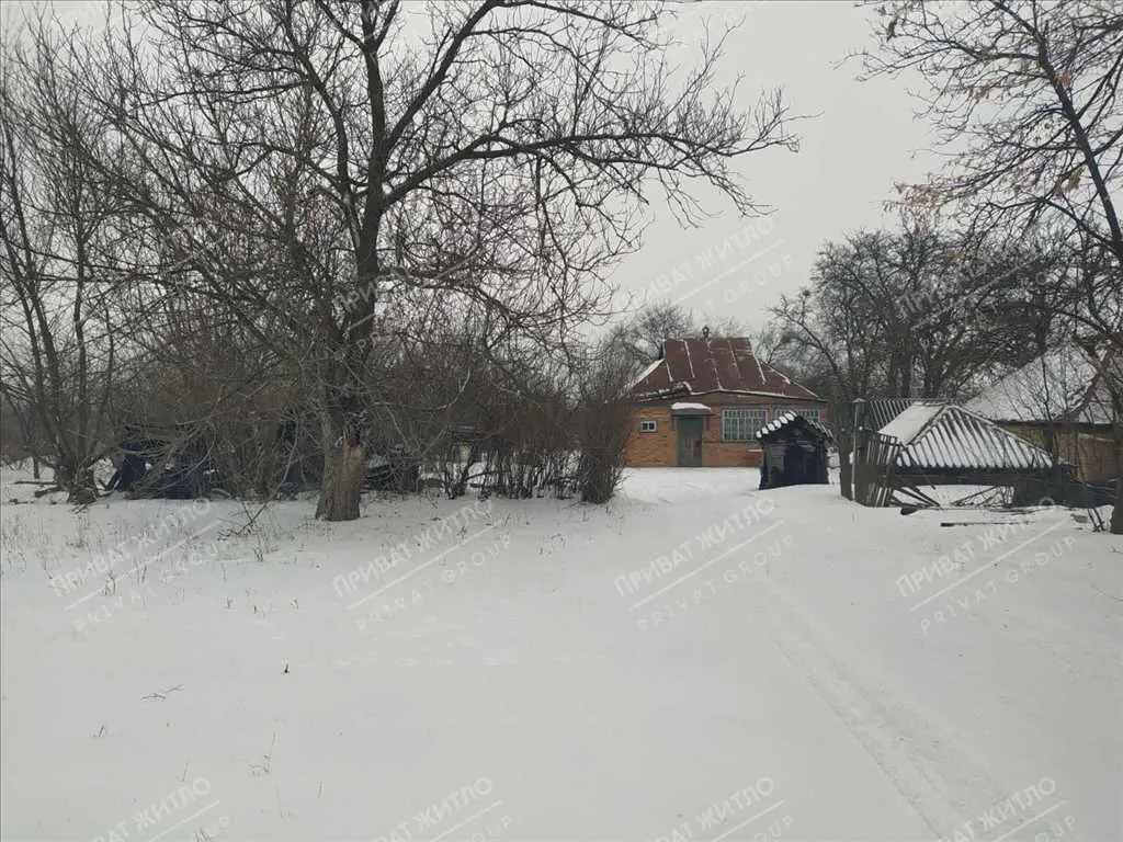 Ділянка з будинком під знос