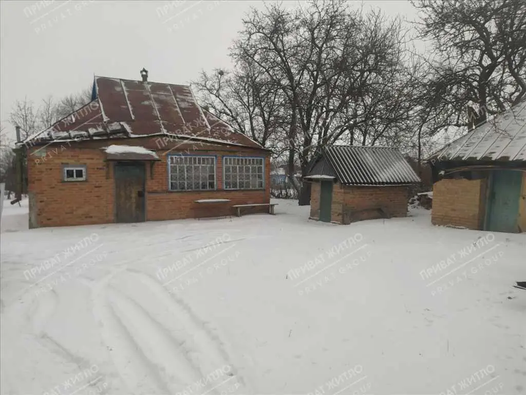 Ділянка з будинком під знос