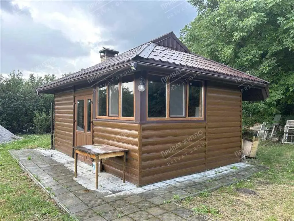 Затишний будинок з ділянкою в передмісті Полтави